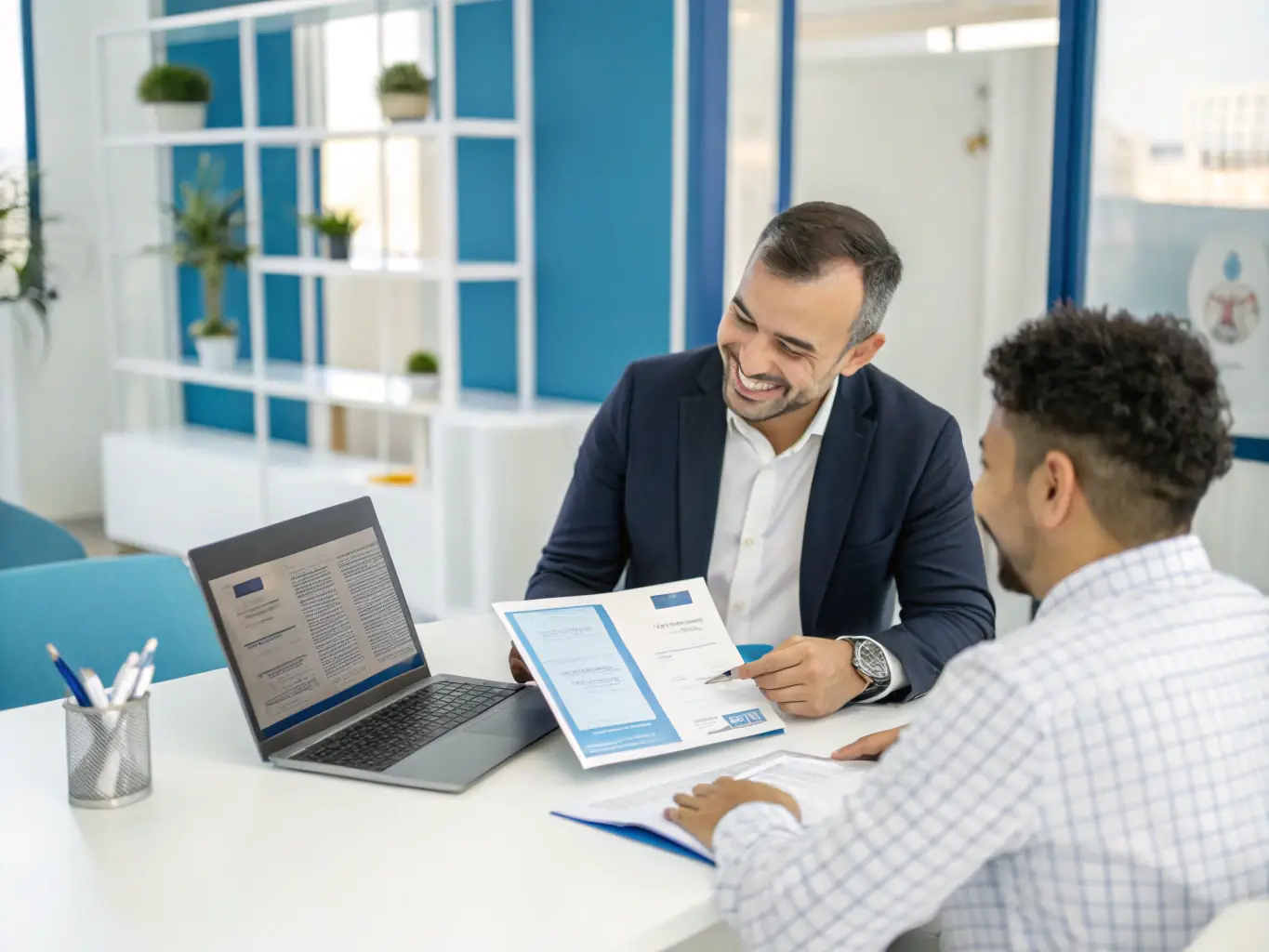 A friendly VisaIndo consultant reviewing documents with a client in a modern office setting, both smiling confidently.